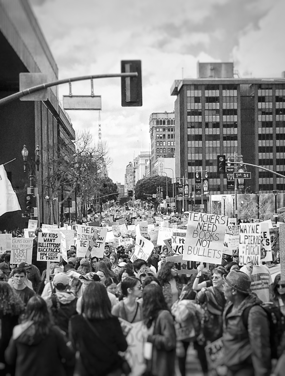 A black and white photo of a protest for gun free schools